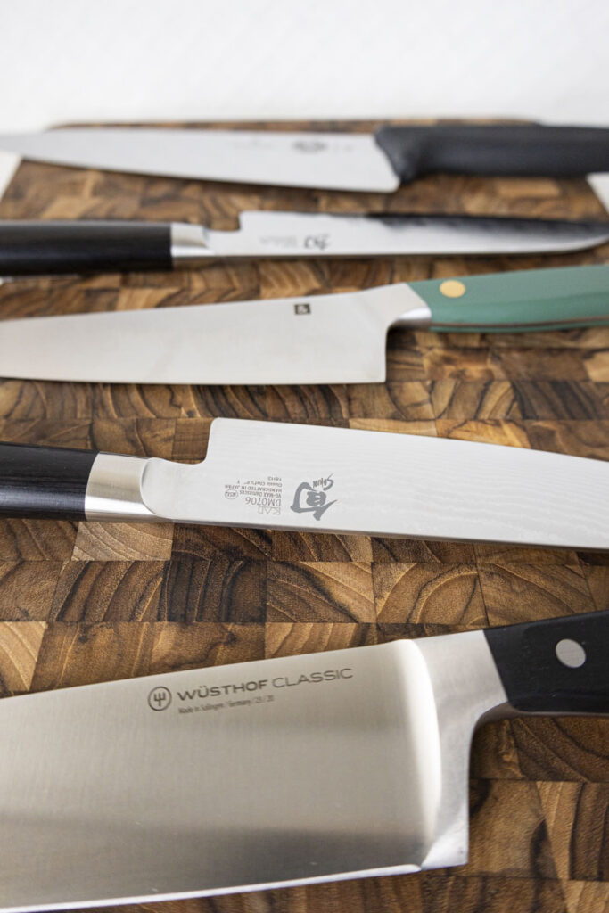 chef's knives on a chopping block